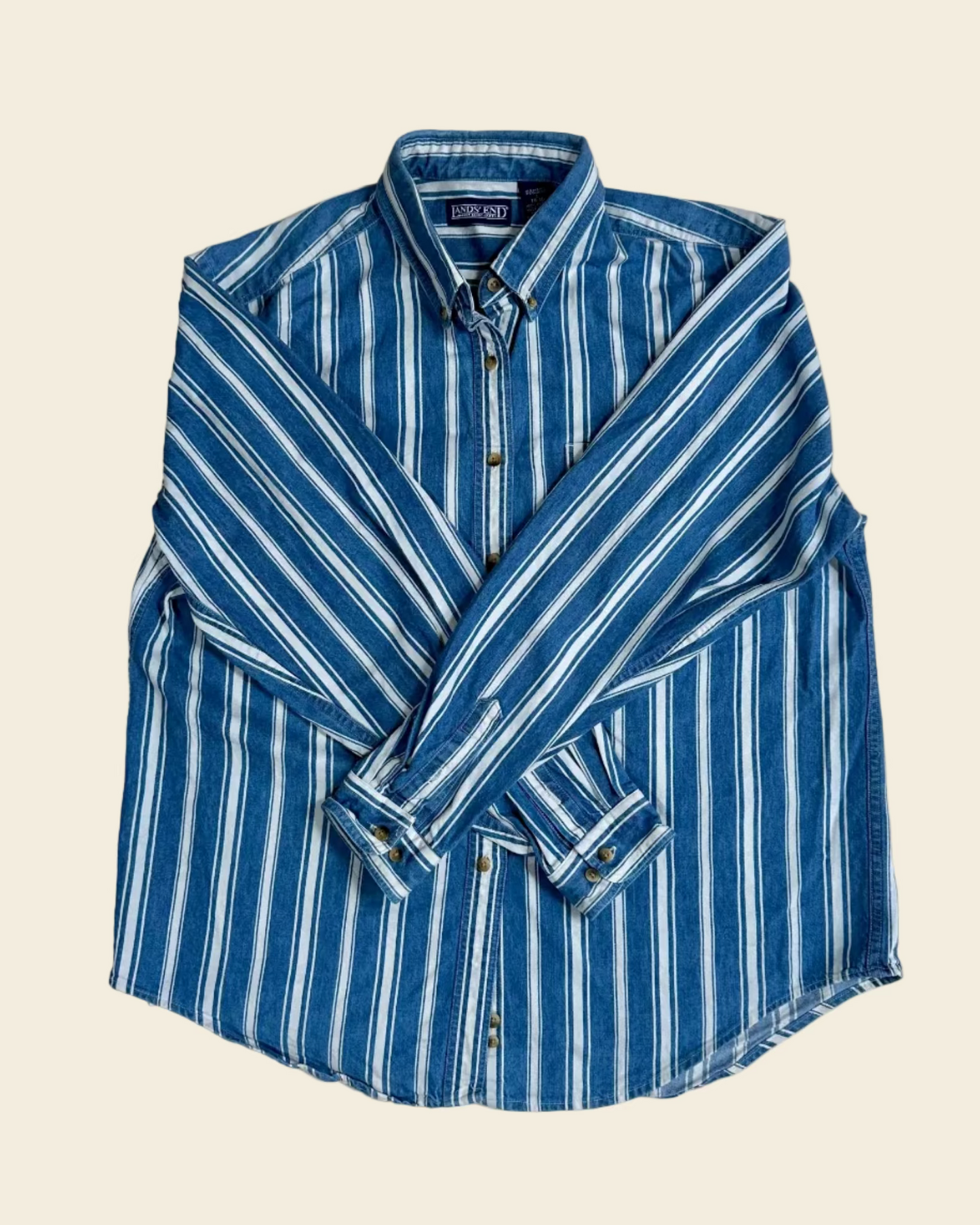 Blue and white striped shirt on a beige background