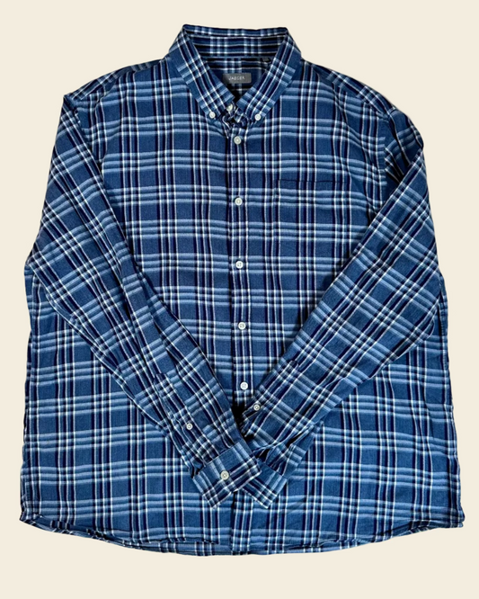 Blue plaid shirt on a beige background