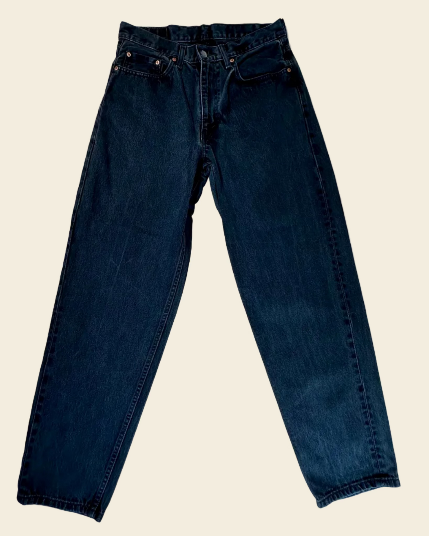Pair of black jeans on a white background